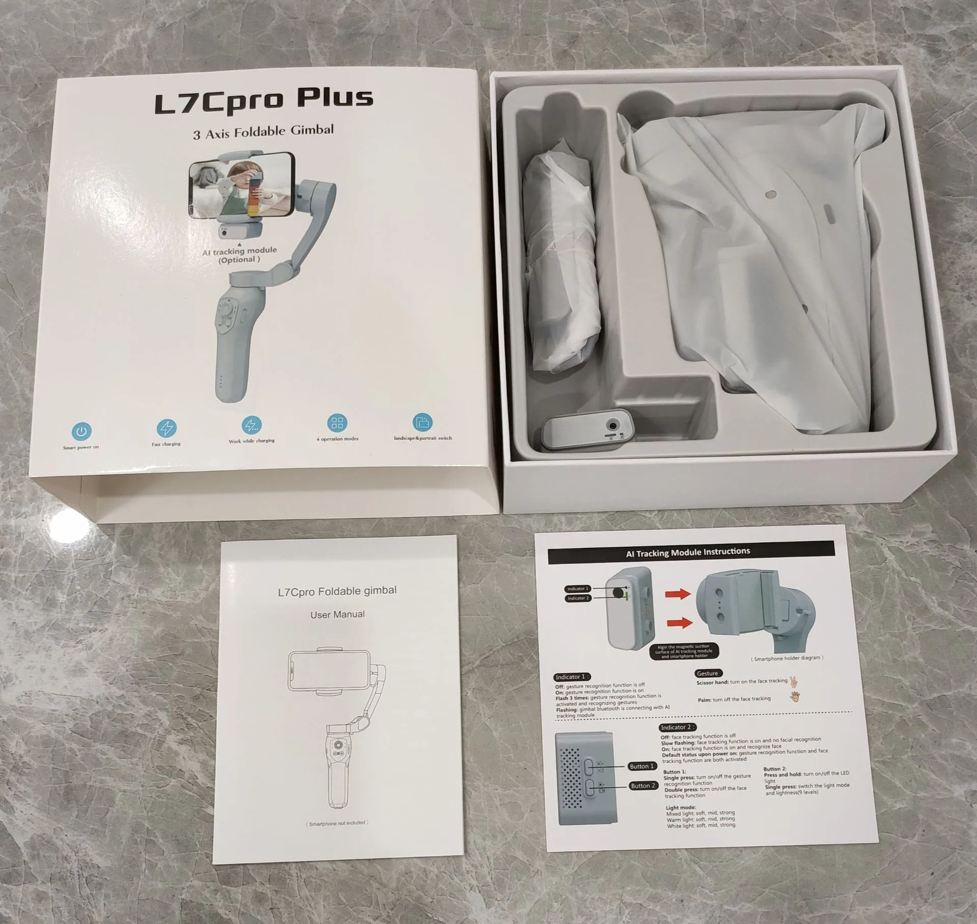 New foldable handheld stabiliser in silver grey for mobile phone with Type-C cable and manual