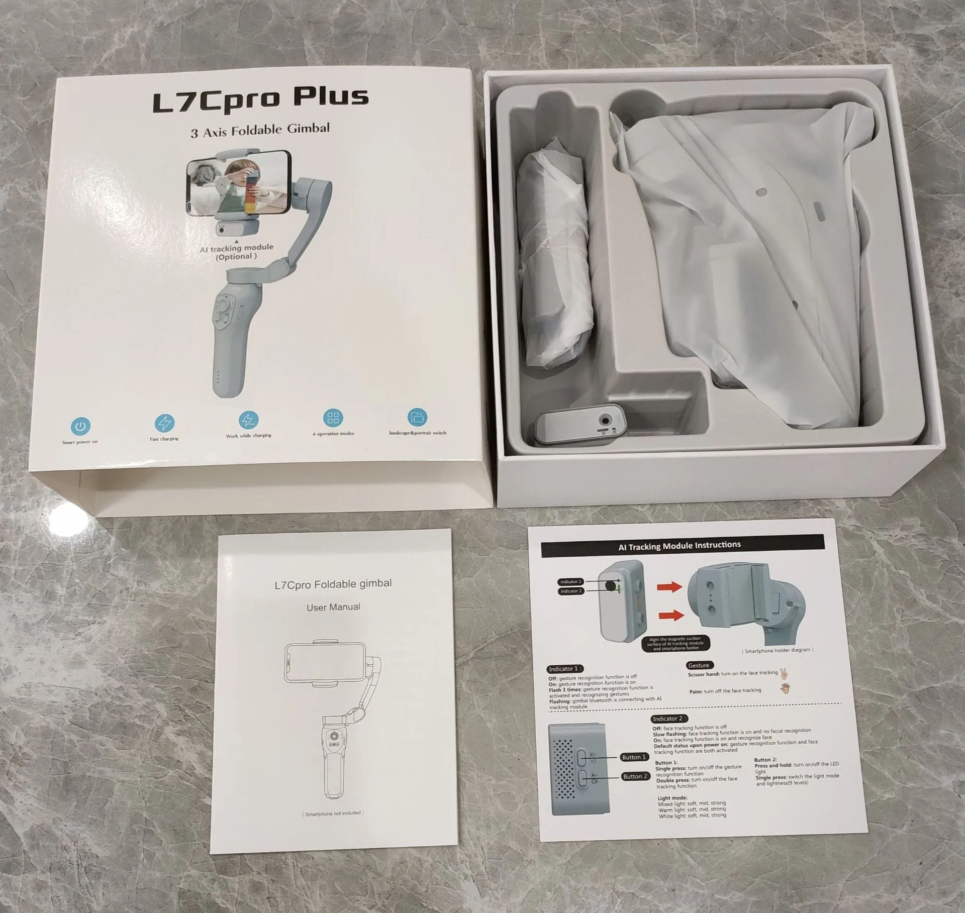 New foldable handheld stabiliser in silver grey for mobile phone with Type-C cable and manual