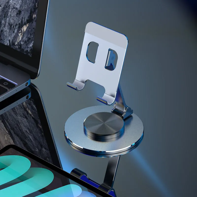 Aluminium alloy rotating mobile phone bracket in silver on a desk, showing three-axis joint and metal texture finish