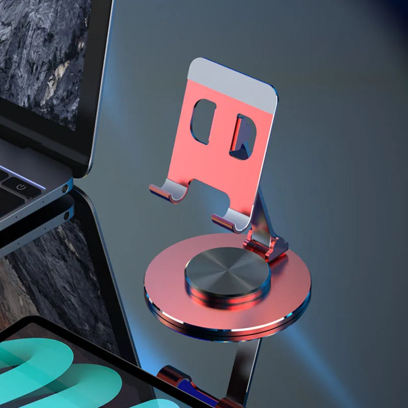 Aluminium alloy rotating mobile phone bracket in silver on a desk, showing three-axis joint and metal texture finish