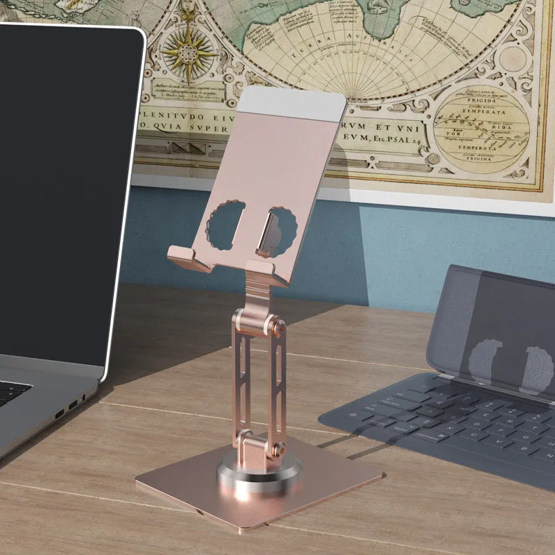 Aluminium alloy rotating mobile phone bracket in silver on a desk, showing three-axis joint and metal texture finish