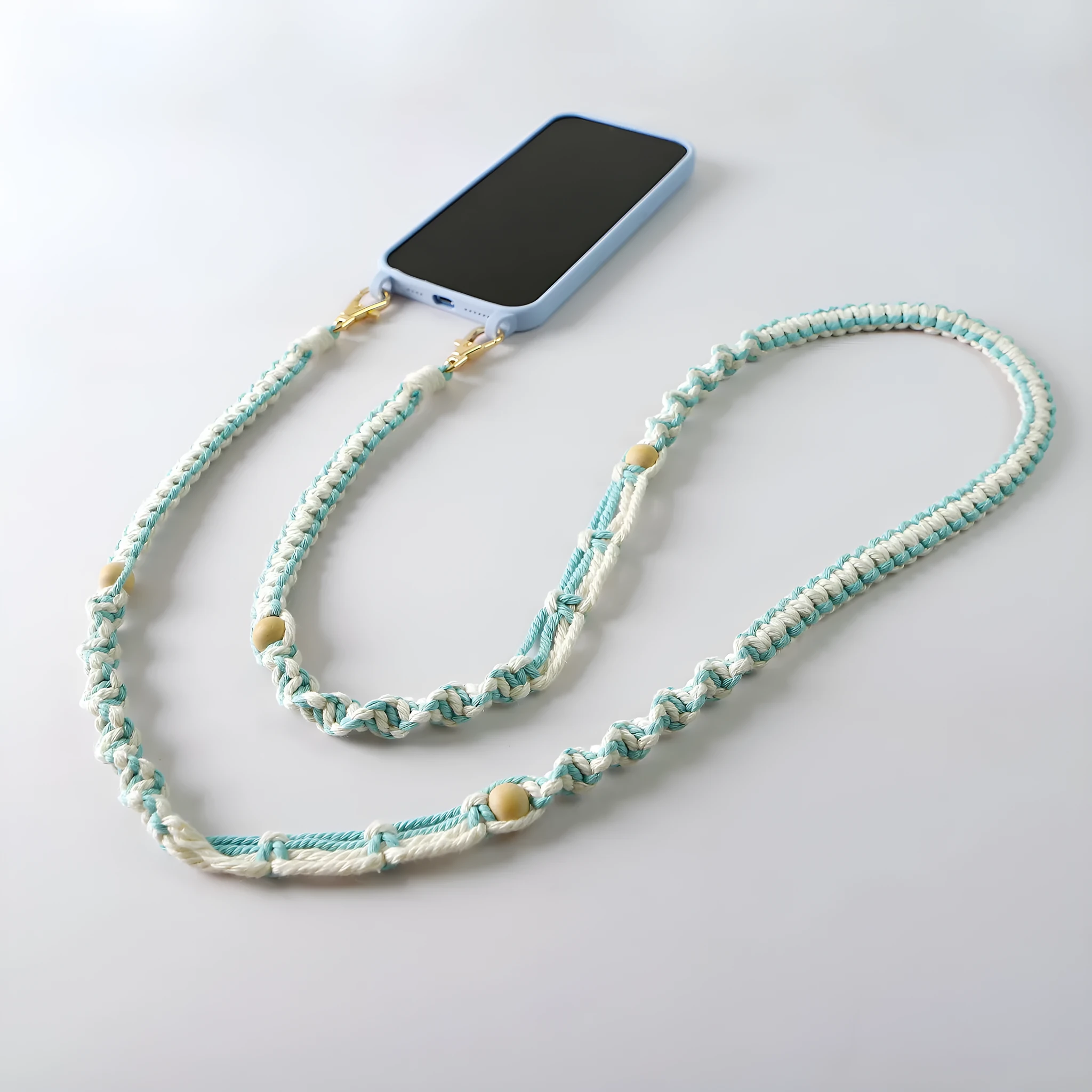 Hand-woven cotton mobile phone charm crossbody strap with alloy connectors in bohemian vintage pastoral style, available in multiple colours.