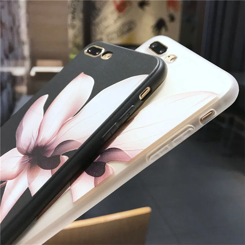 Black and white iPhone TPU cases with a raised embossed floral pattern on the back.