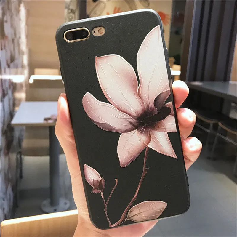 Black and white iPhone TPU cases with a raised embossed floral pattern on the back.