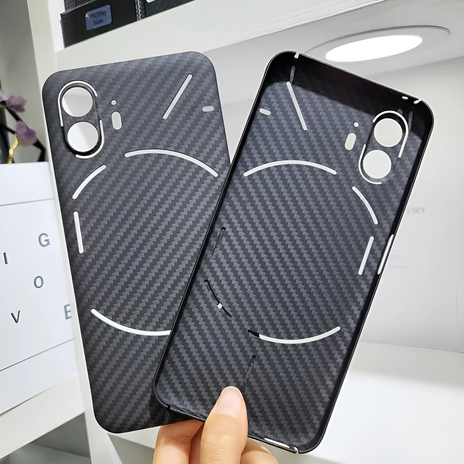 Real aramid fiber phone case in matte black hollow finish for Nothing Phone 2 with plaid texture