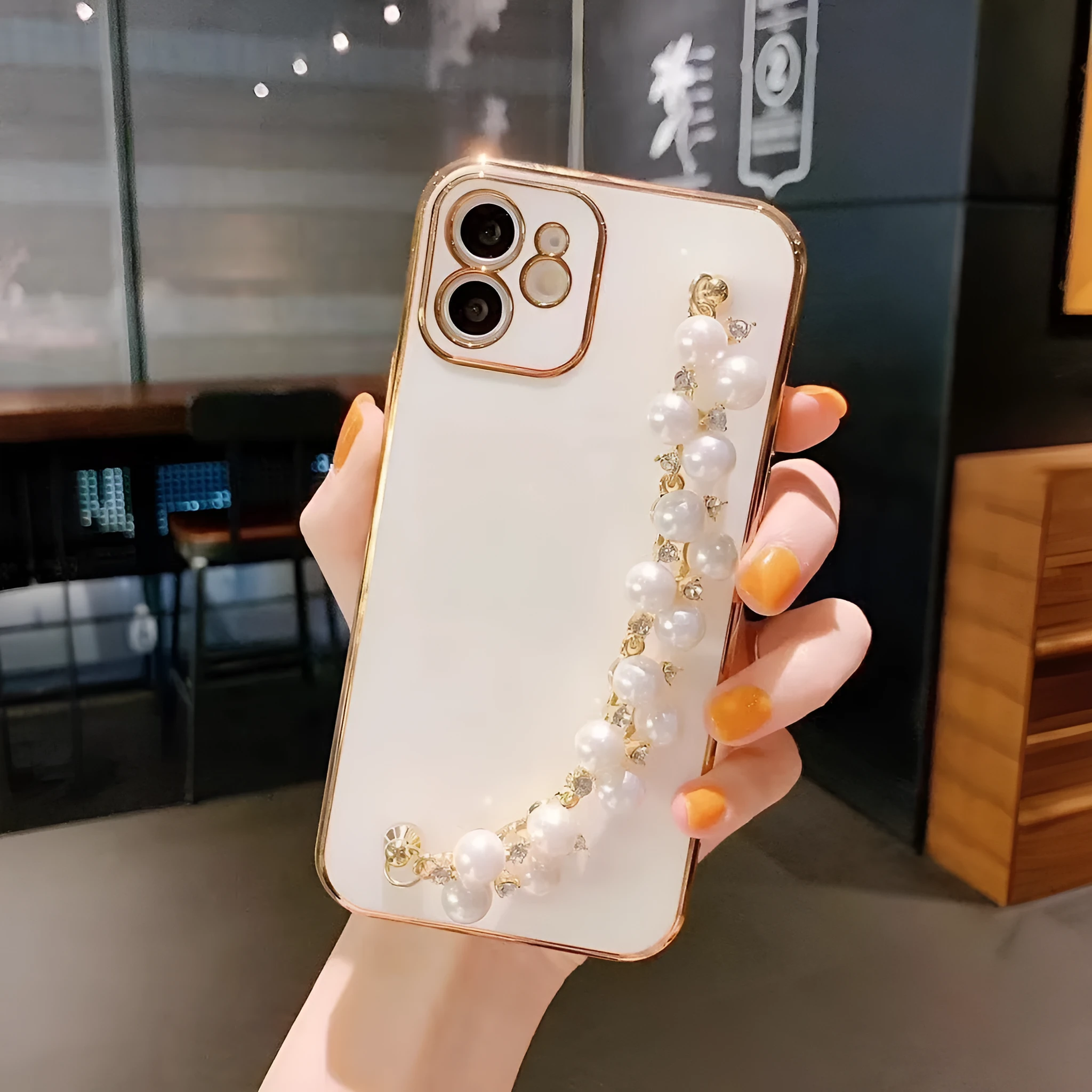 Electroplated pearl bracelet silicone phone case for Apple 15, all-inclusive cover with chain detail, black shell