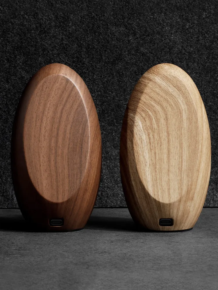 Creative Magsafe magnetic phone holder wireless charger in walnut resin colour on desk, 15.5cm length
