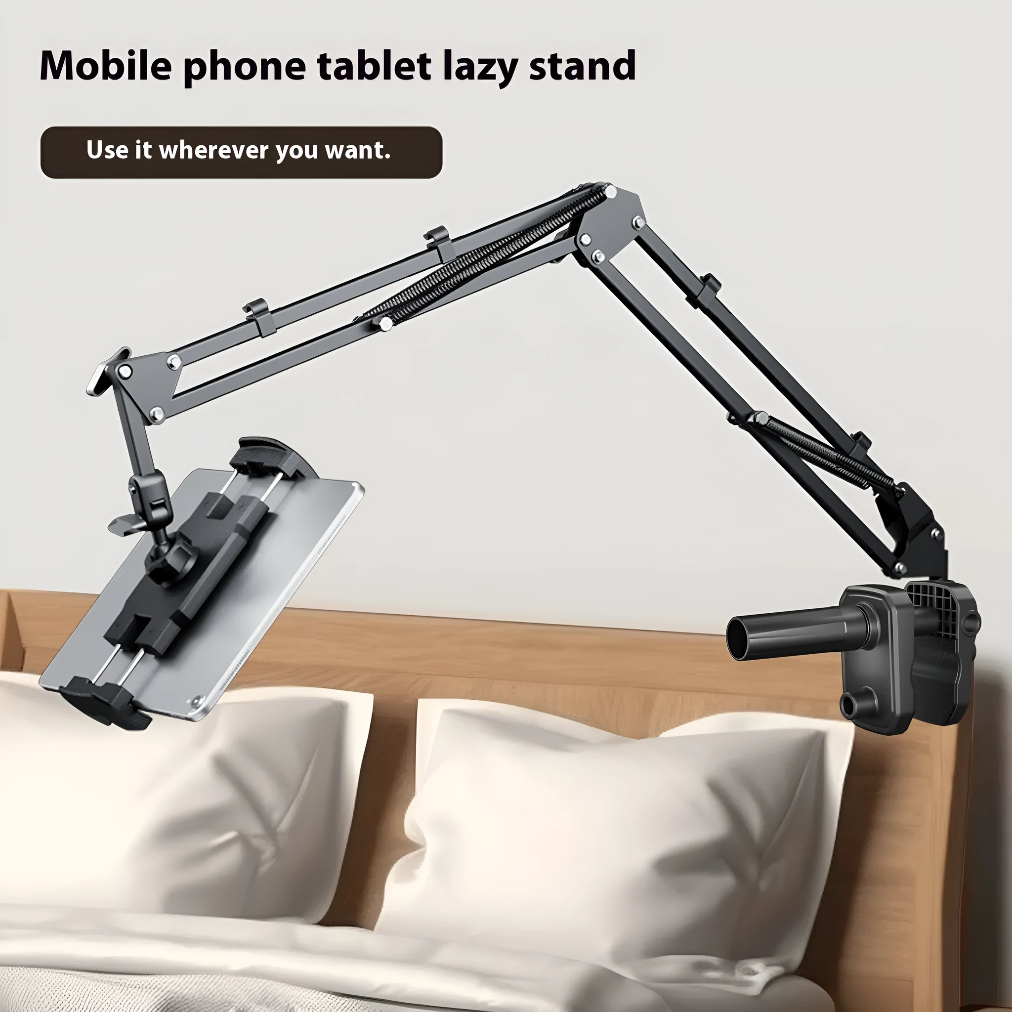 Metal cantilever bracket bedside table with four clips holding a mobile phone