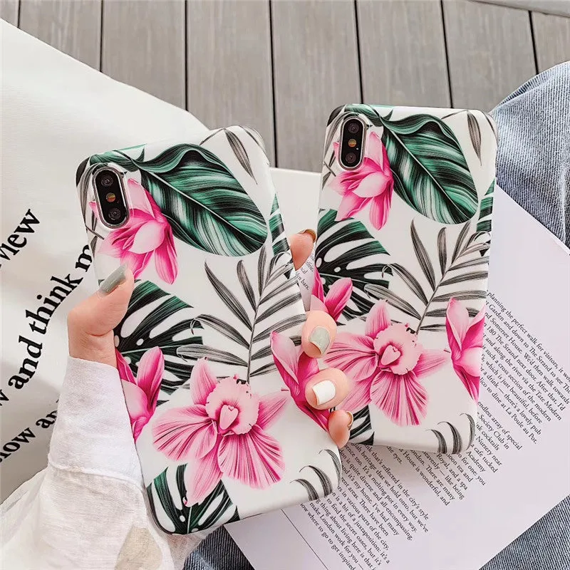 Pink flower design TPU phone case for iPhone on a table.