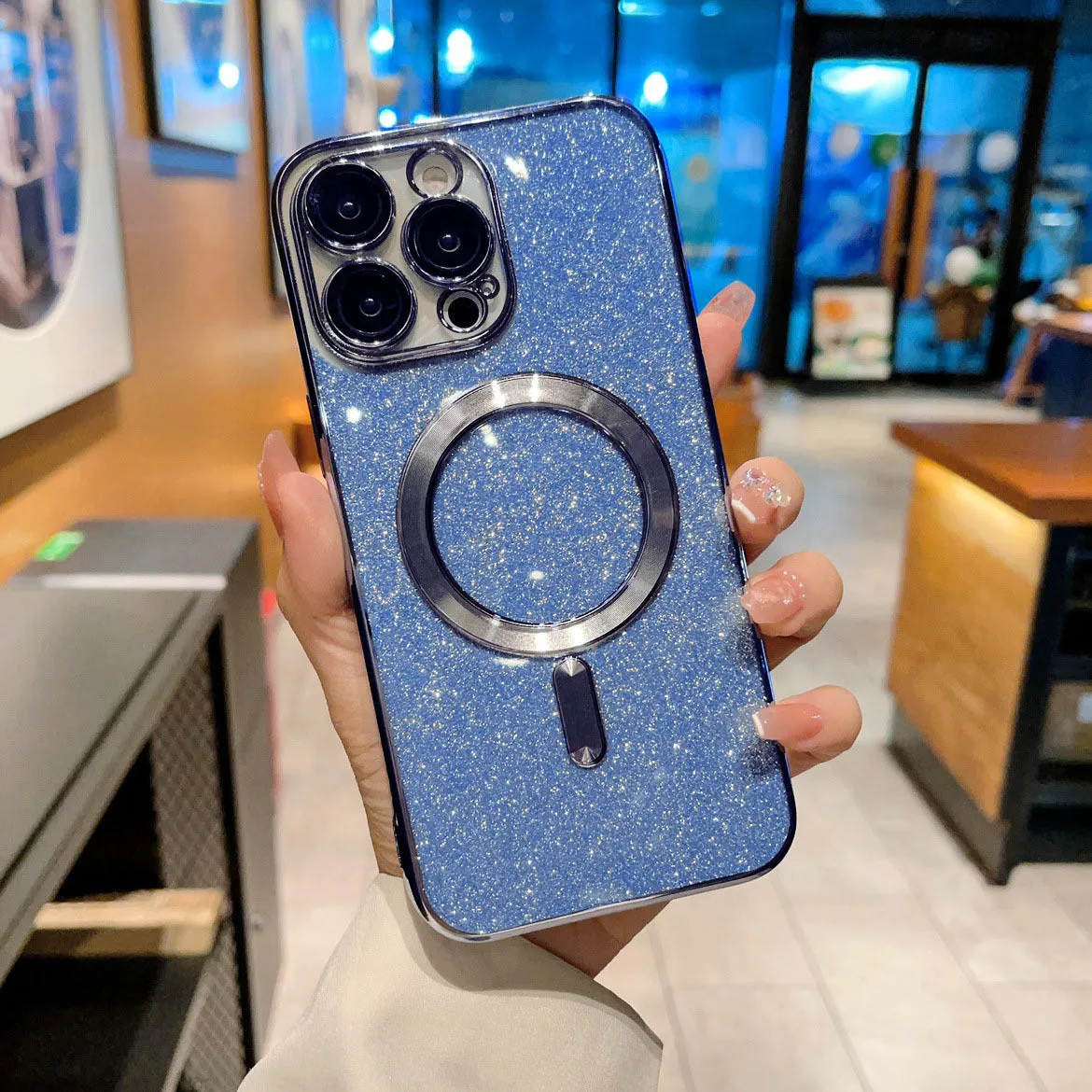 Transparent magnetic TPU phone case for iPhone, showing coloured edges in blue, with raised camera bezel