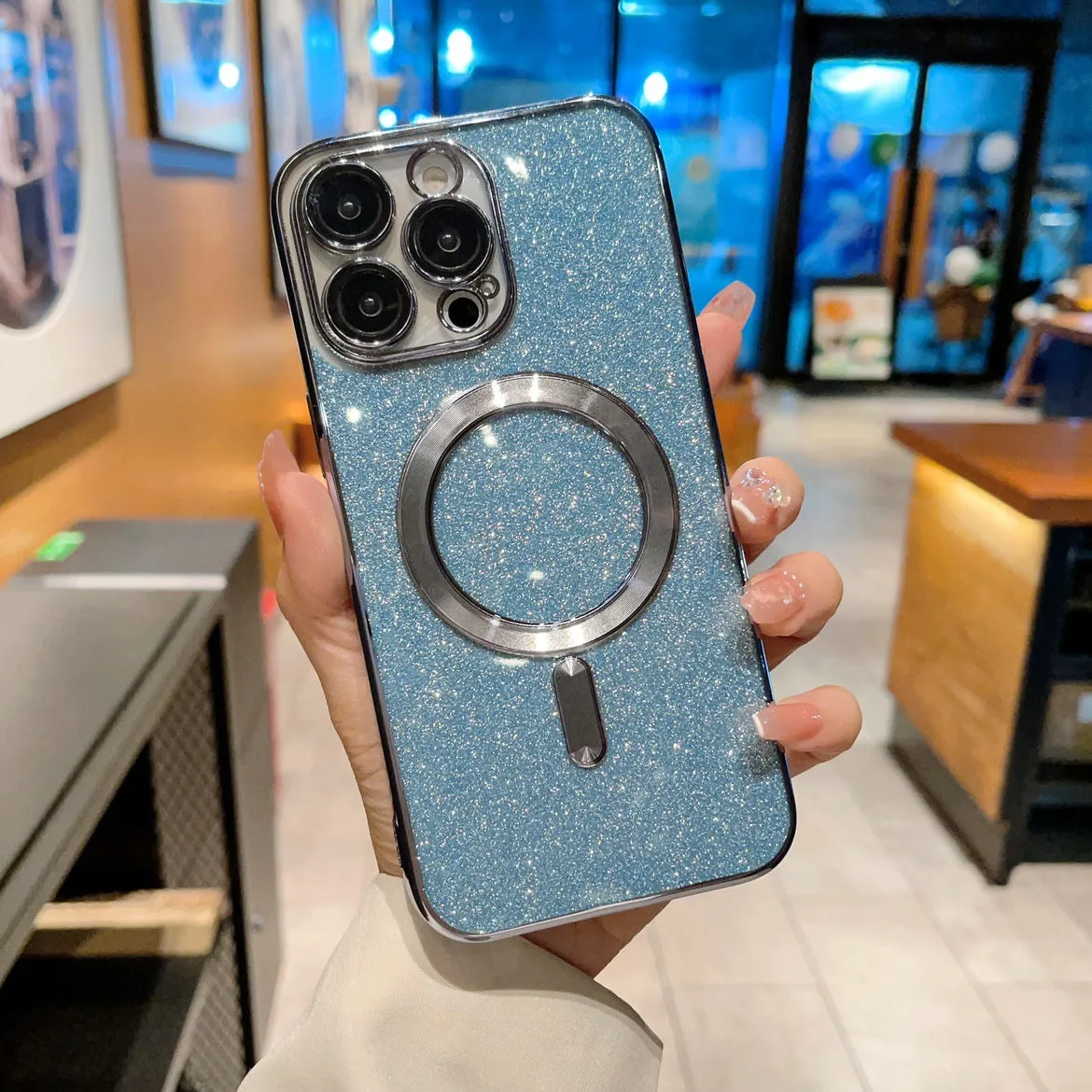 Transparent magnetic TPU phone case for iPhone, showing coloured edges in blue, with raised camera bezel