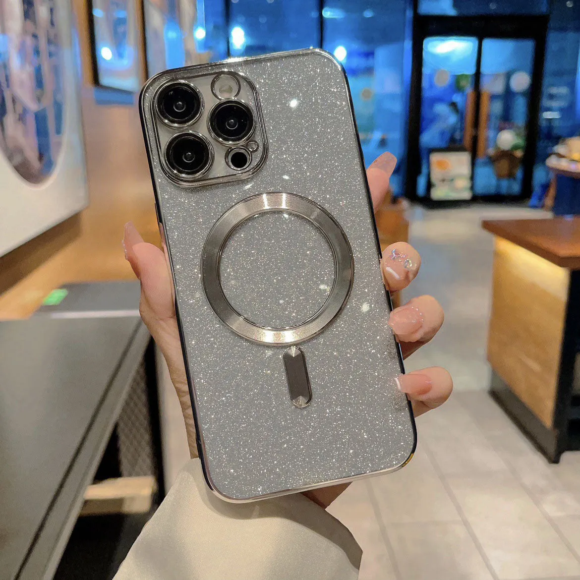 Transparent magnetic TPU phone case for iPhone, showing coloured edges in blue, with raised camera bezel