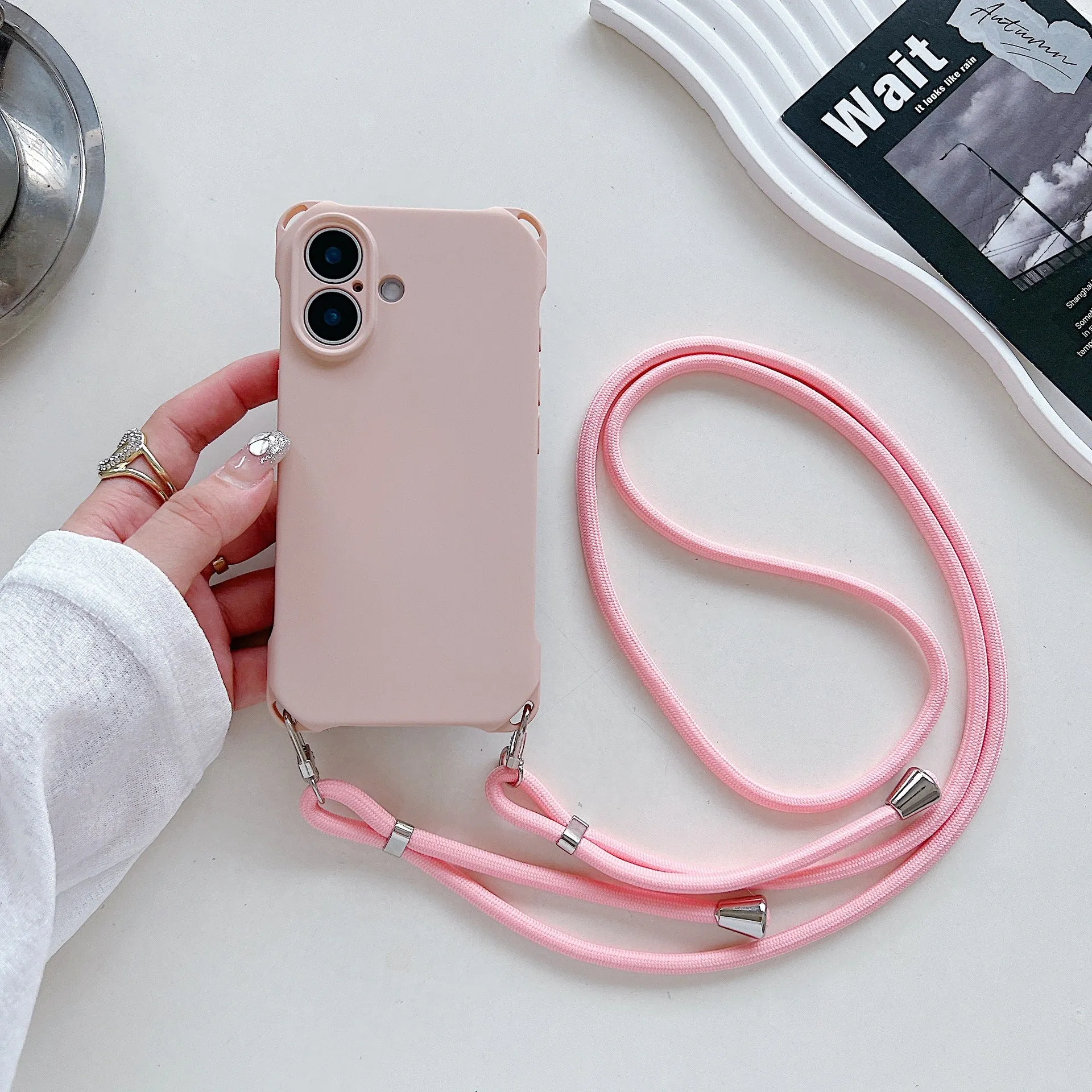 Four-corner cross lanyard liquid silicone phone case for Apple iPhone 16, soft anti-fall, antique white colour