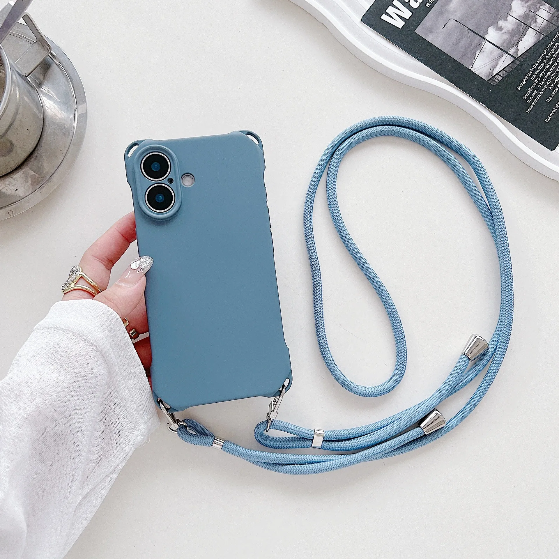 Four-corner cross lanyard liquid silicone phone case for Apple iPhone 16, soft anti-fall, antique white colour
