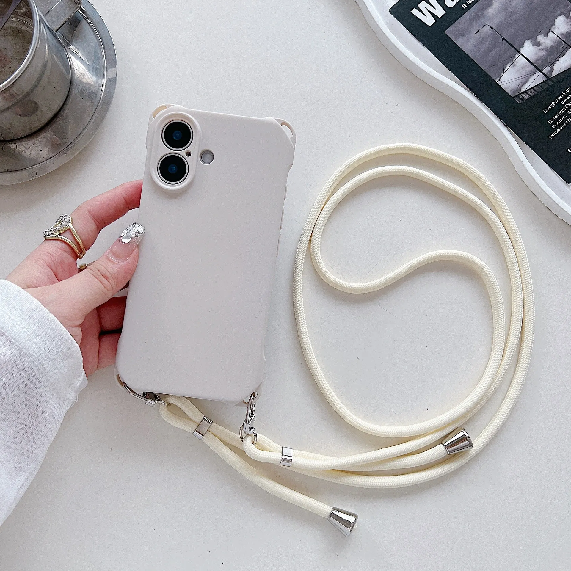 Four-corner cross lanyard liquid silicone phone case for Apple iPhone 16, soft anti-fall, antique white colour