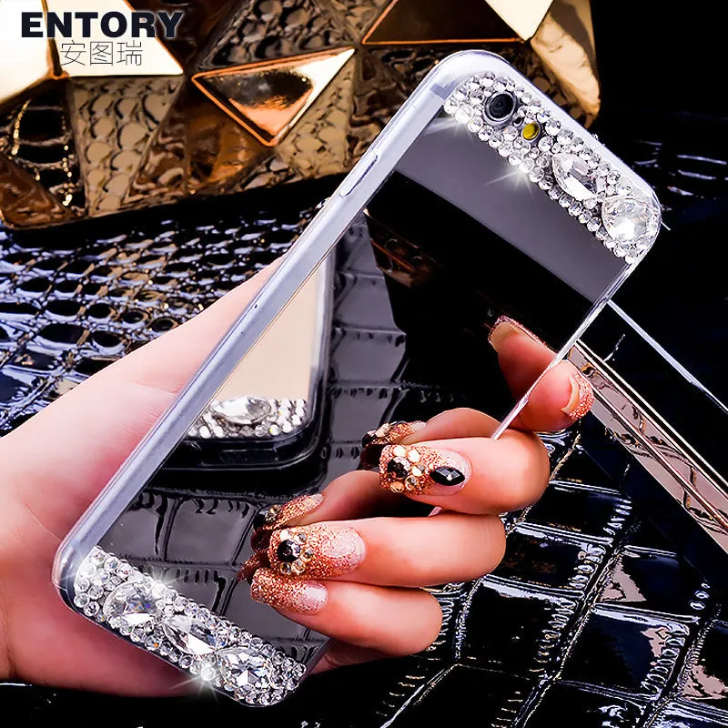 Gold rhinestone decorative silicone back cover case for a Huawei smartphone on a table.