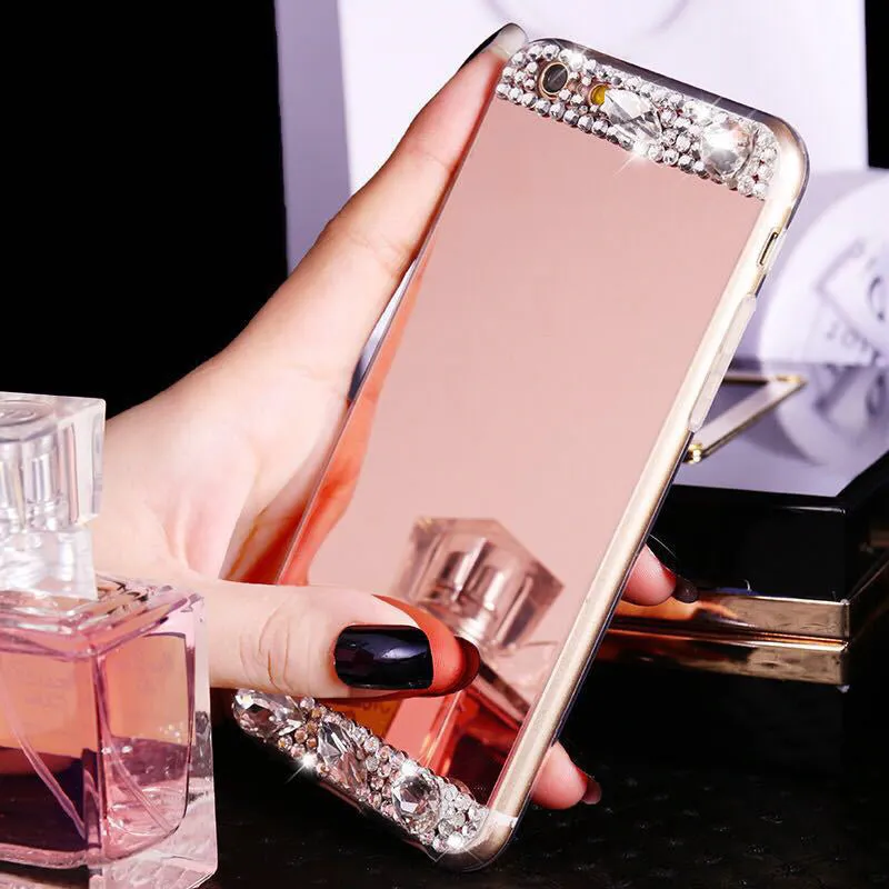 Gold rhinestone decorative silicone back cover case for a Huawei smartphone on a table.