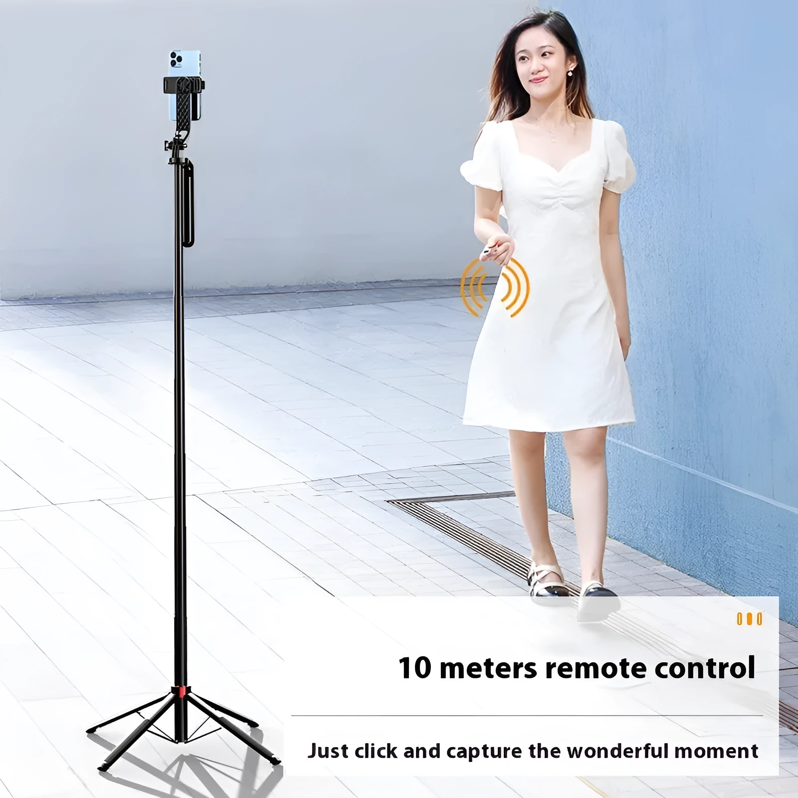 Bluetooth quadrupod selfie stick tripod with remote control, phone clamp, and four legs extended on a table