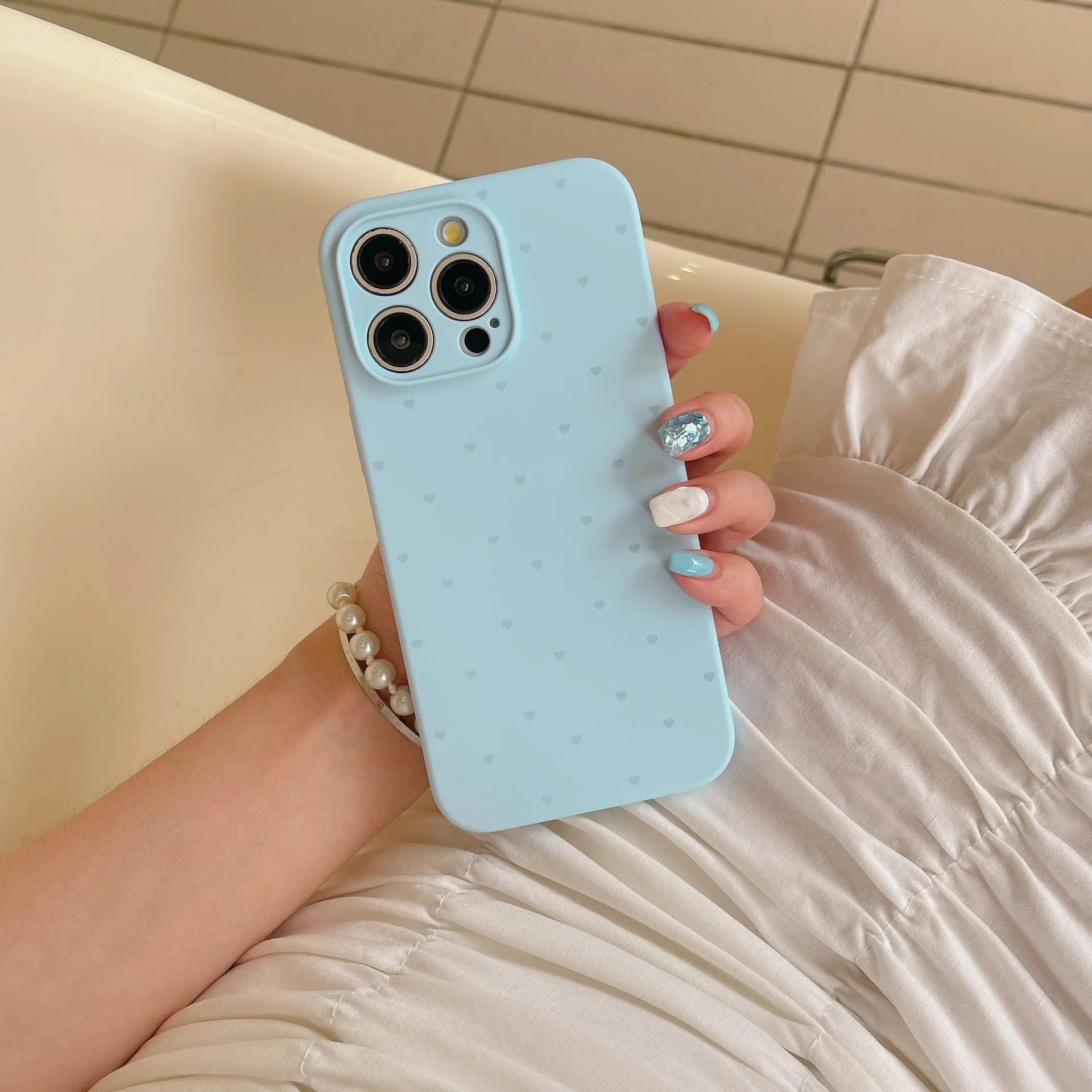 Liquid silicone phone case with love heart design in antique white, fits iPhone 13 Pro Max