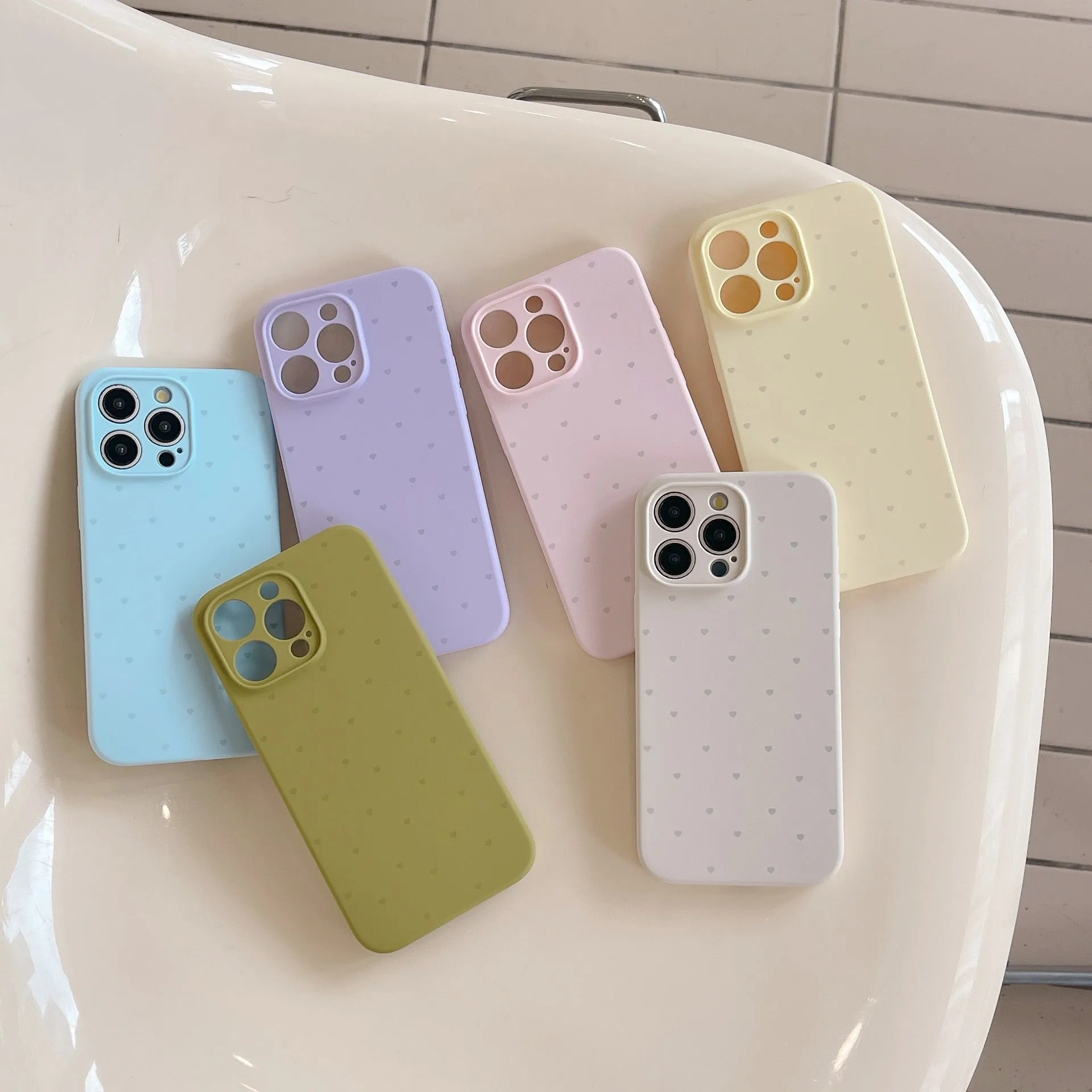 Liquid silicone phone case with love heart design in antique white, fits iPhone 13 Pro Max
