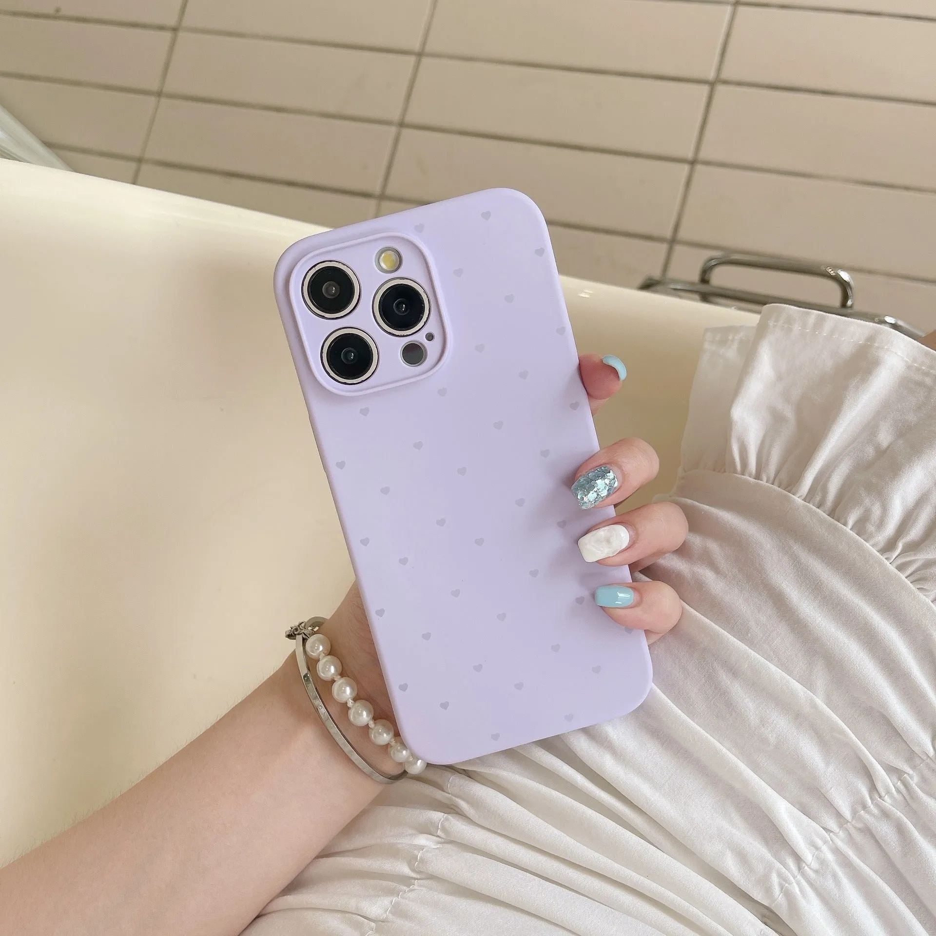 Liquid silicone phone case with love heart design in antique white, fits iPhone 13 Pro Max