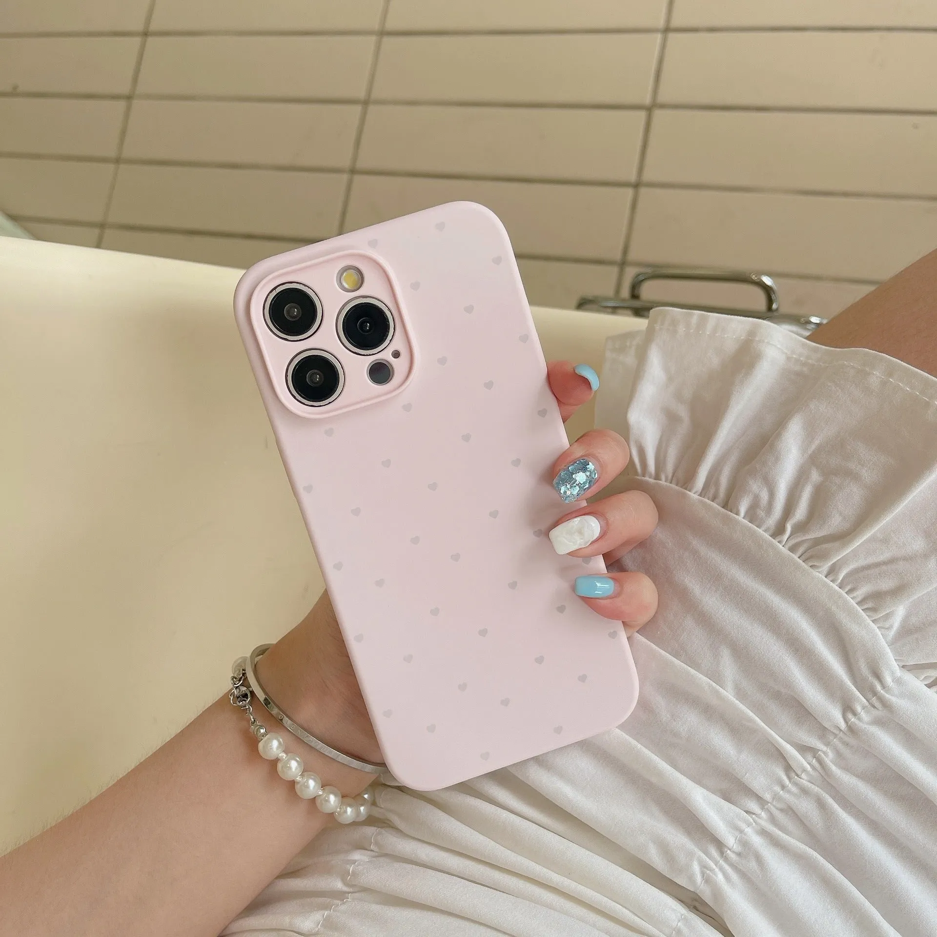 Liquid silicone phone case with love heart design in antique white, fits iPhone 13 Pro Max