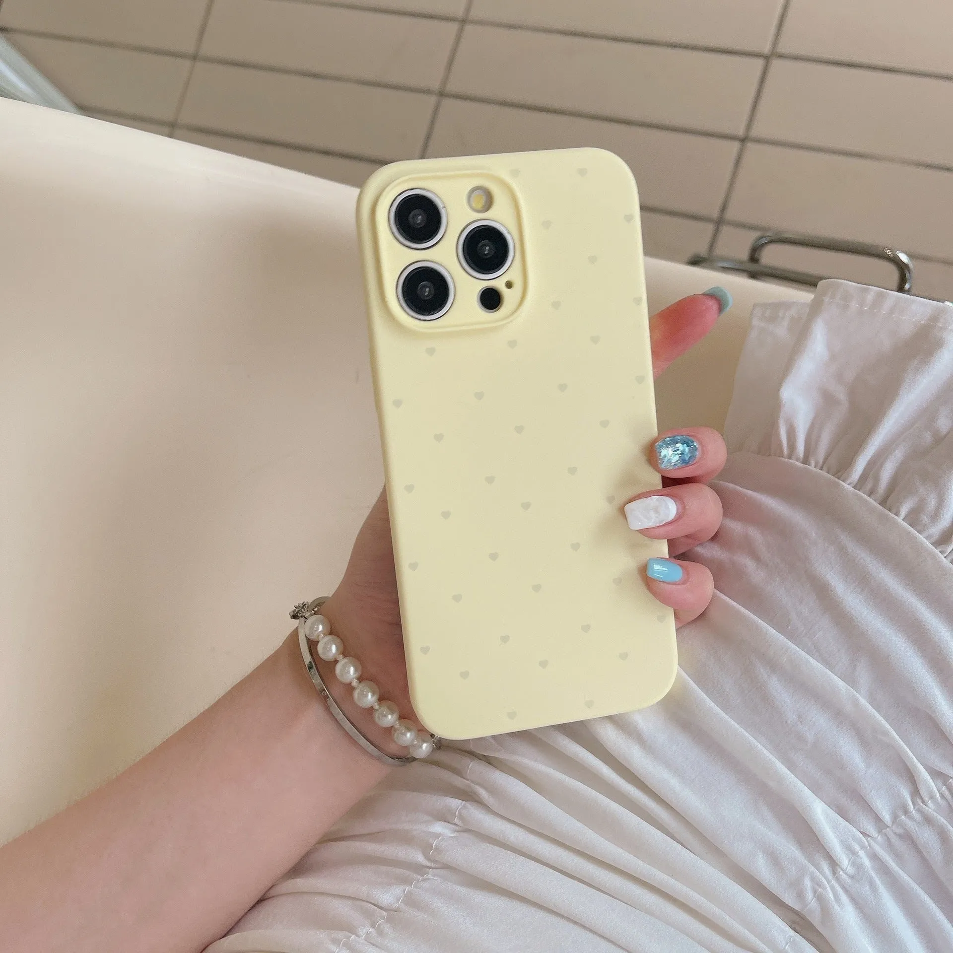 Liquid silicone phone case with love heart design in antique white, fits iPhone 13 Pro Max