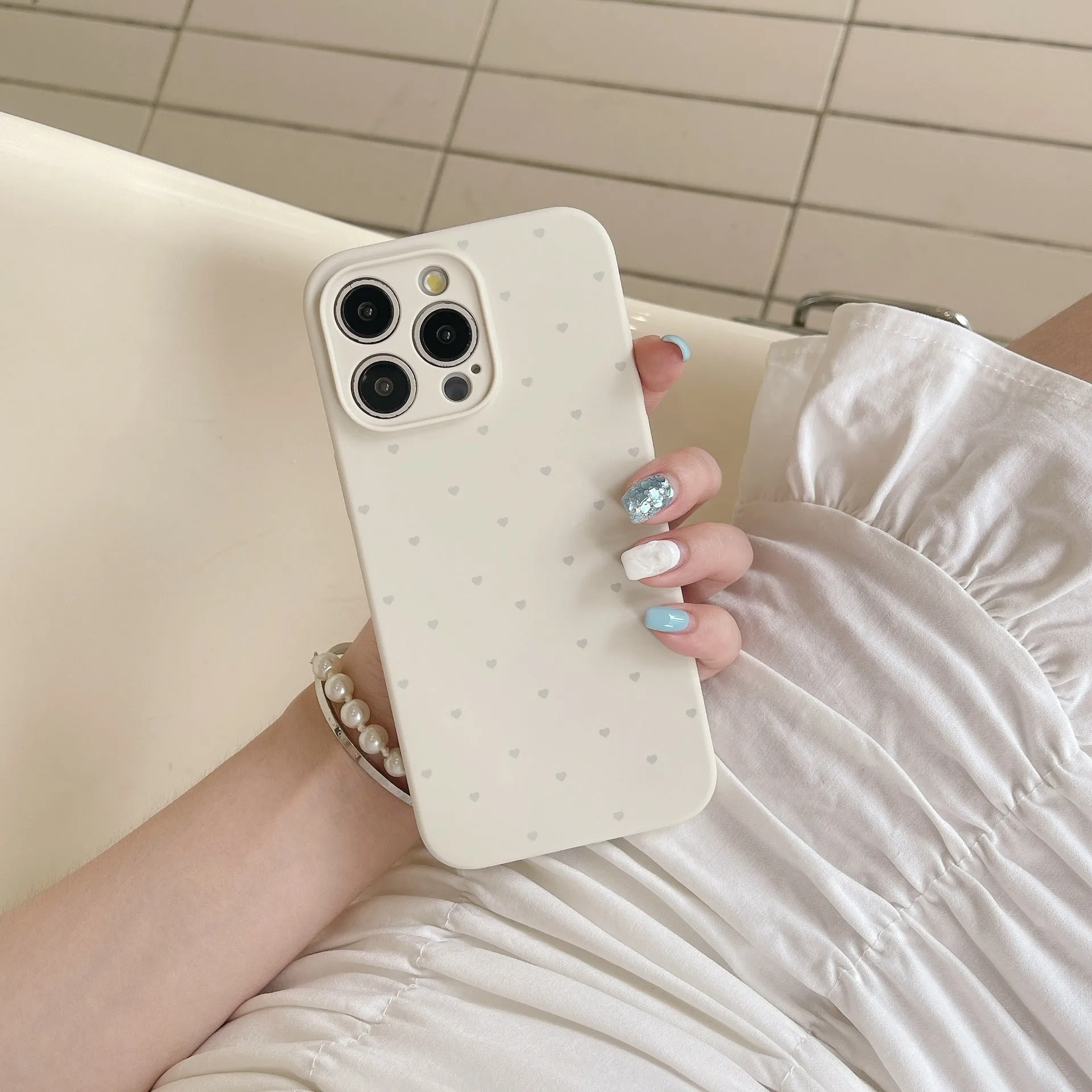Liquid silicone phone case with love heart design in antique white, fits iPhone 13 Pro Max