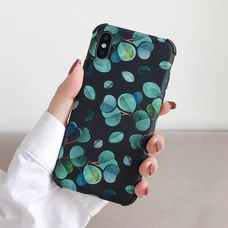 Black silicone iPhone case with leaf pattern texture and raised camera protection rim