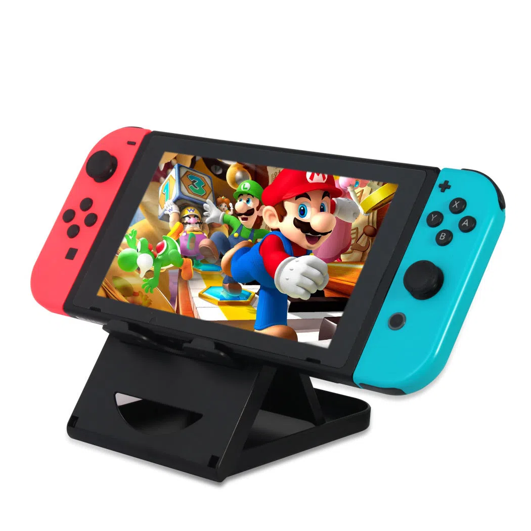 Black adjustable ABS game console stand for Switch on a desktop surface