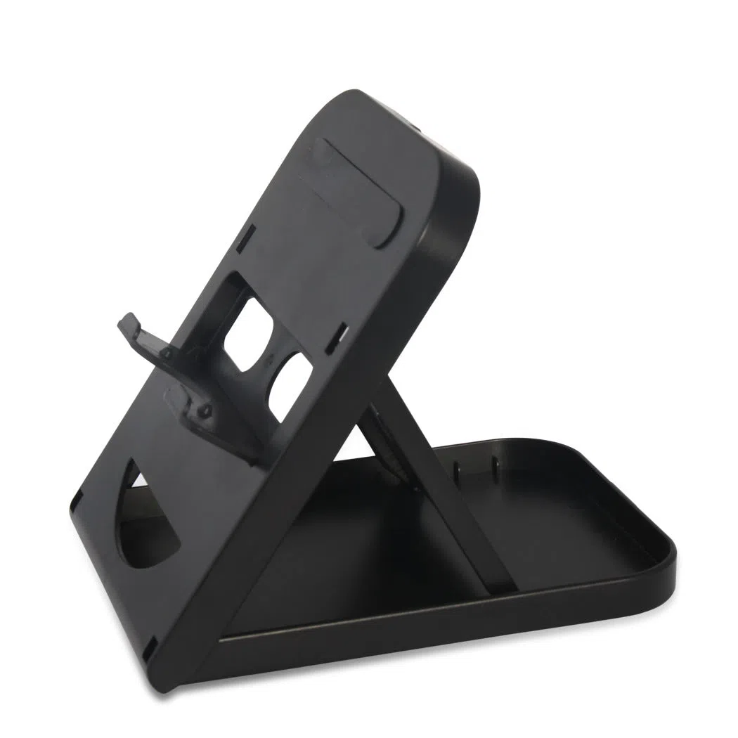 Black adjustable ABS game console stand for Switch on a desktop surface