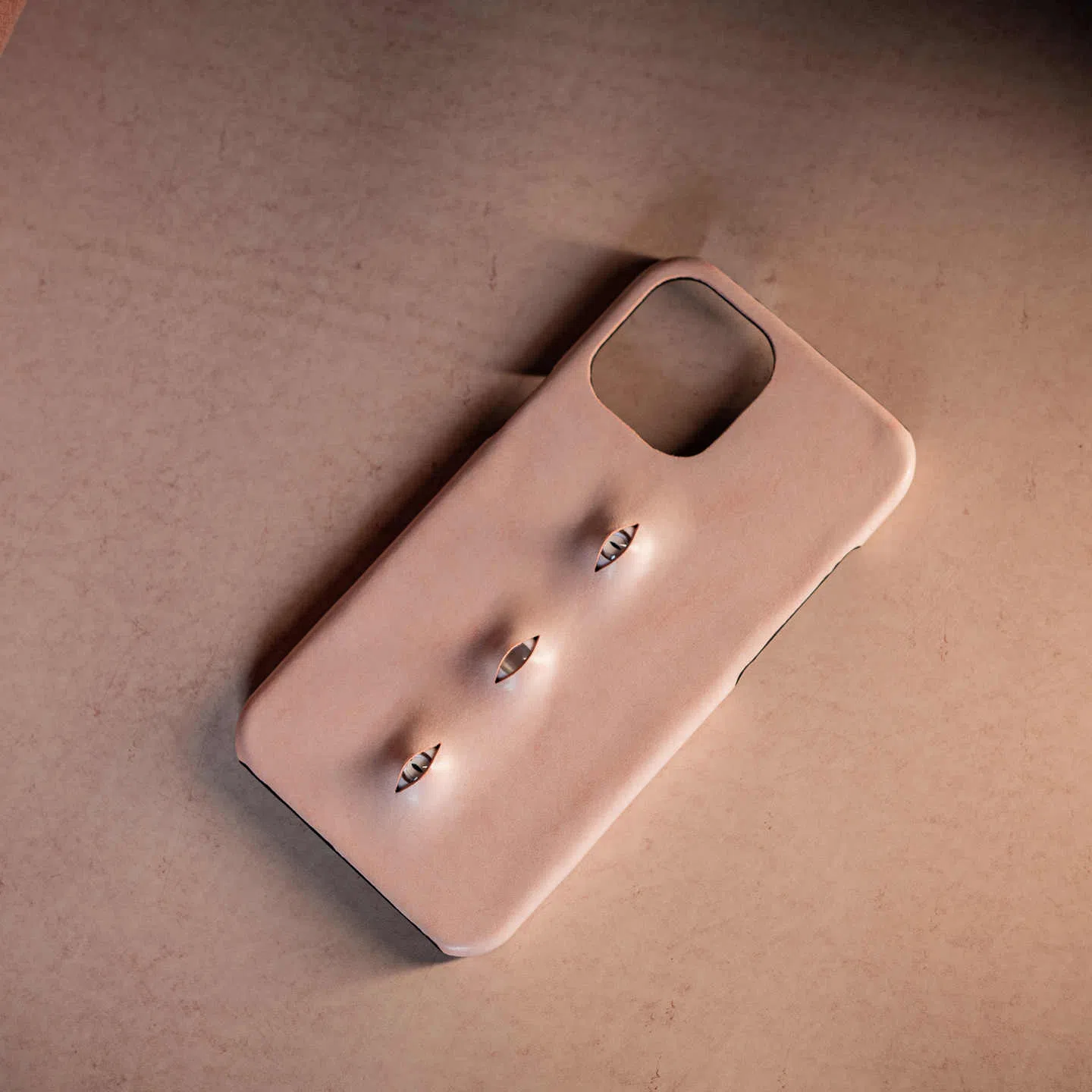 Handmade waxed cowhide leather eye phone case in pink with three-eye vertical design