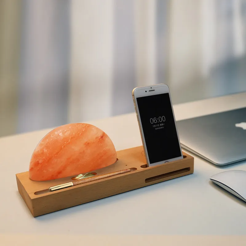 Wireless charging salt lamp with natural crystal salt shade on a solid beech wood base.