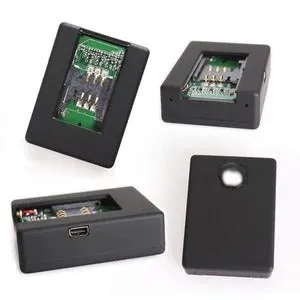 Black mini car GPS tracker with SIM card slot for vehicle security and location monitoring