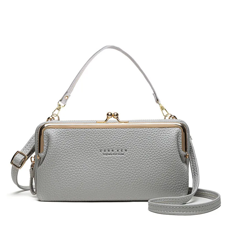 Horizontal Korean ladies messenger mini clutch in PU leather, showing zipper buckle and car suture detail.