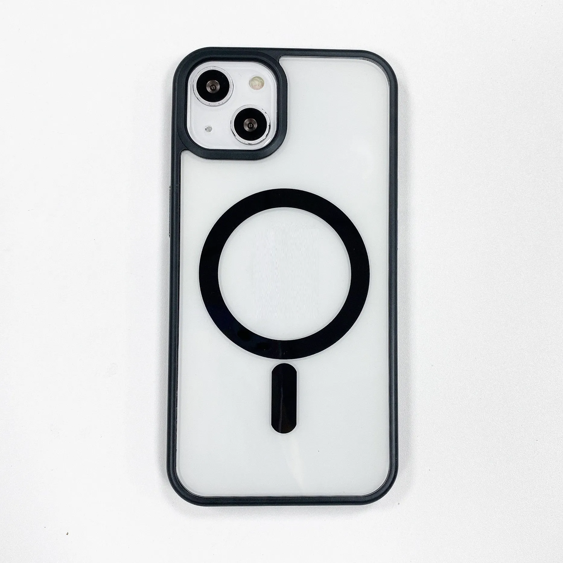 Transparent acrylic MagSafe phone case for iPhone with magnetic ring visible through clear back