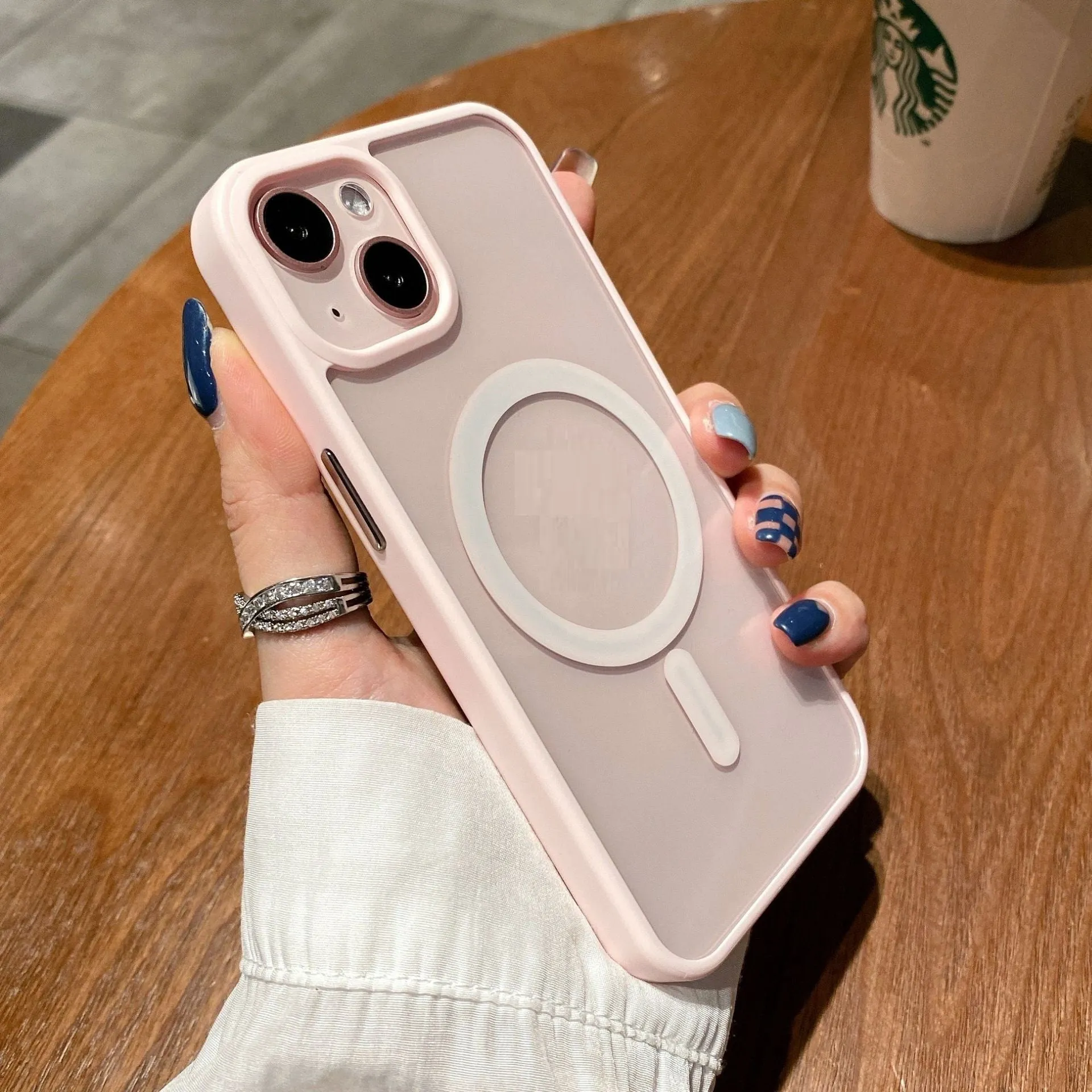 Transparent acrylic MagSafe phone case for iPhone with magnetic ring visible through clear back