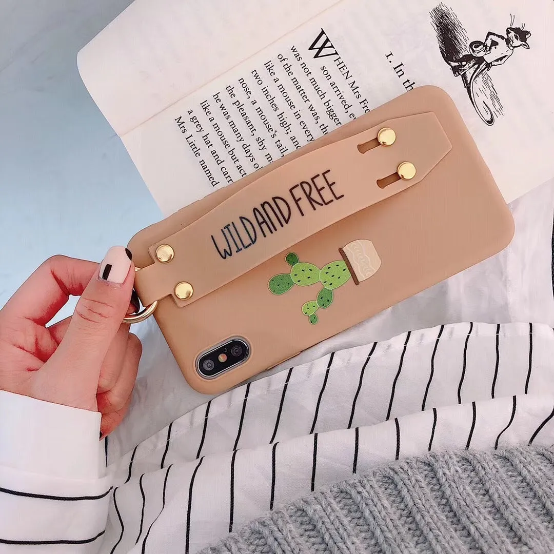 Green graffiti design wristband holder phone case for iPhone on a table.
