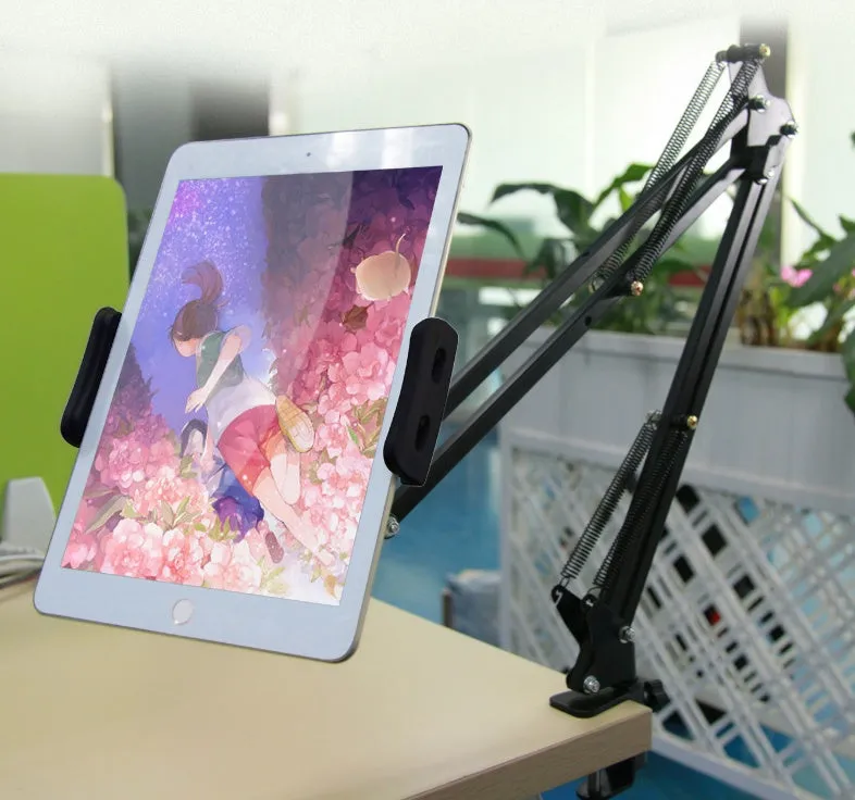 Black and white phone tablet stand on desk holding mobile device
