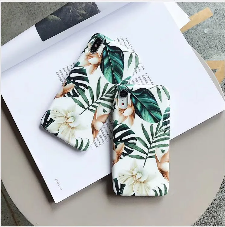 LOVECOM floral iPhone back case with banana leaf design on a smartphone.