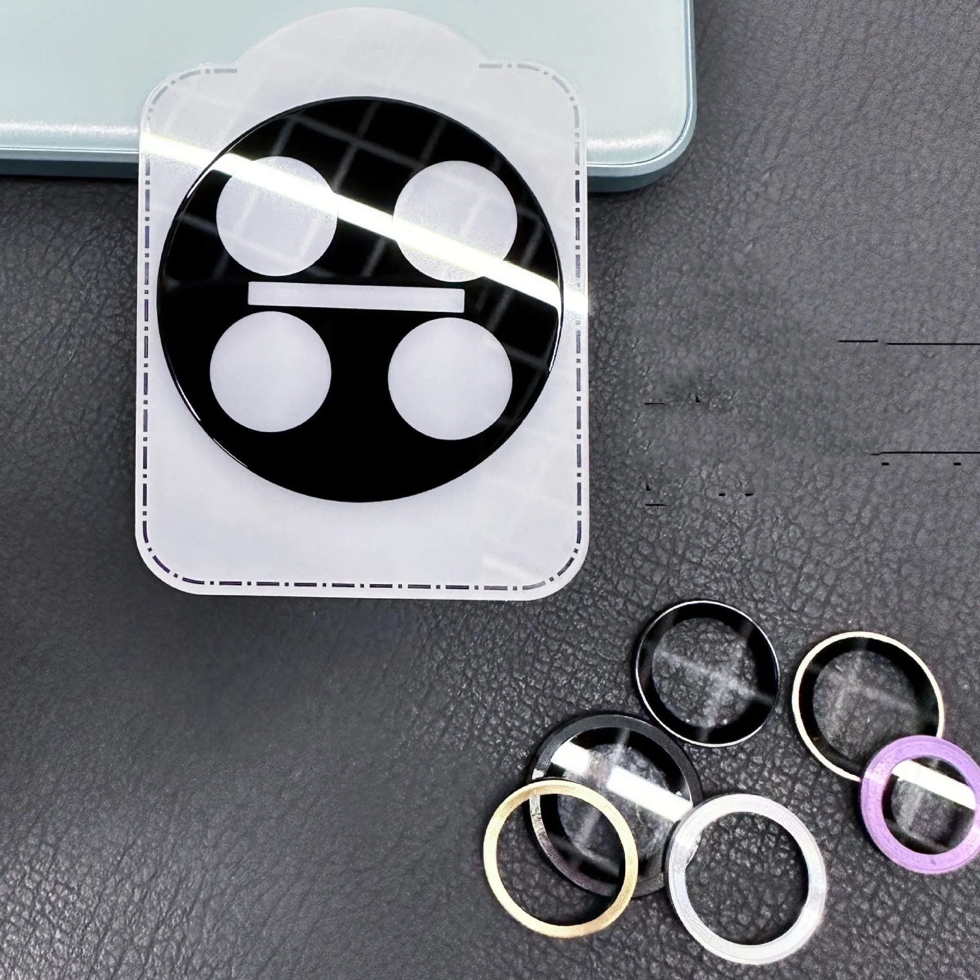 Large arc HD tempered glass lens protector with black alignment ring for OnePlus phones.