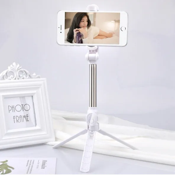 Bluetooth tripod selfie stick with remote control extended to 763mm length showing phone clip rotation