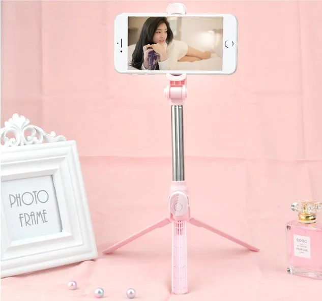 Bluetooth tripod selfie stick with remote control extended to 763mm length showing phone clip rotation