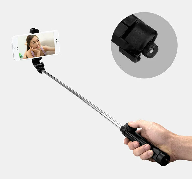 Bluetooth tripod selfie stick with remote control extended to 763mm length showing phone clip rotation