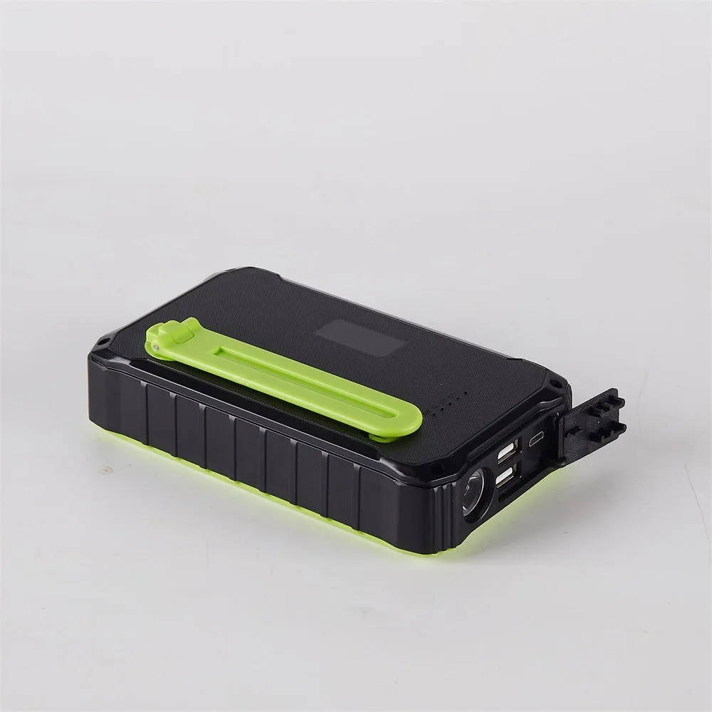 Green and orange hand solar power bank with solar panel, hand crank, and dual USB ports.