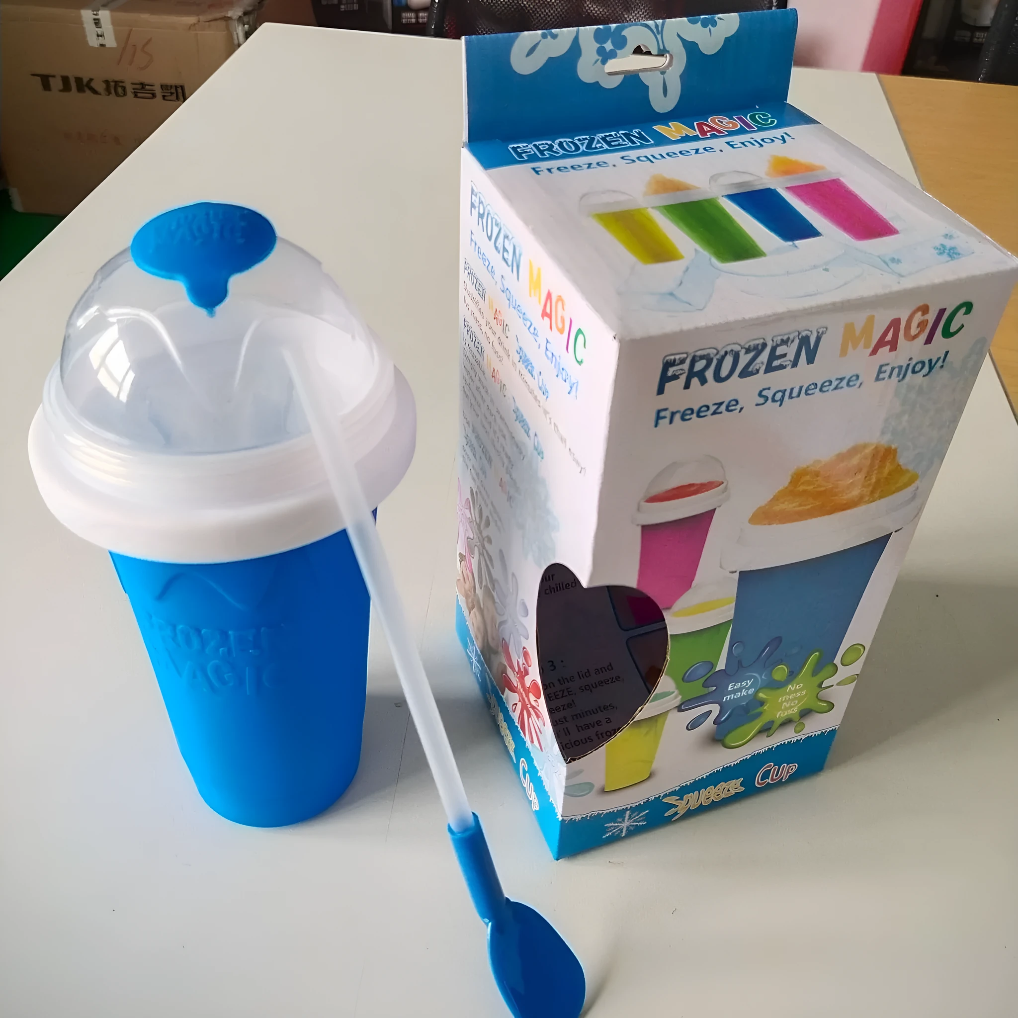 Blue silicone pinch cup for making instant slushy drinks, showing double-wall construction.