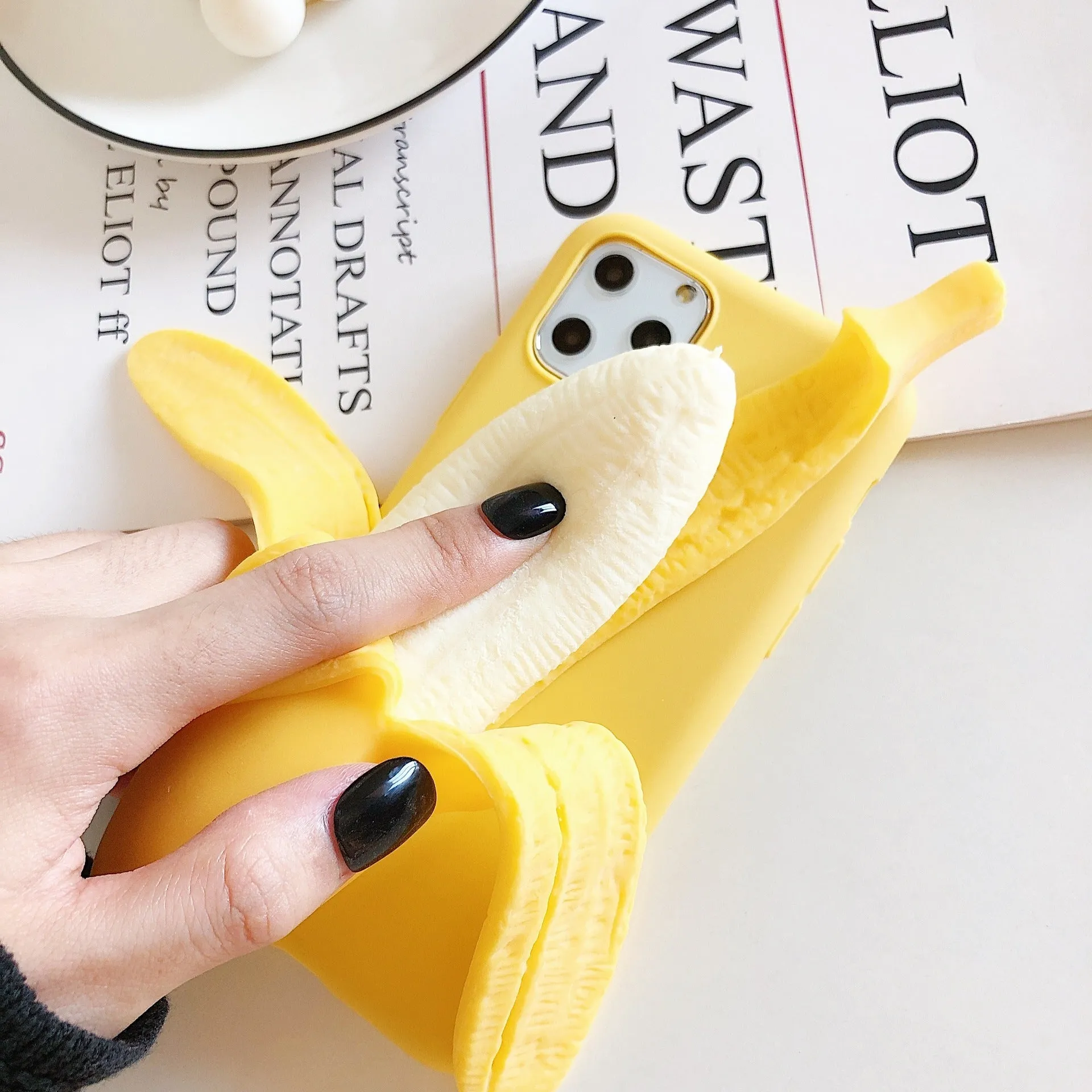 Yellow banana pattern back cover case for iPhone on a white background.