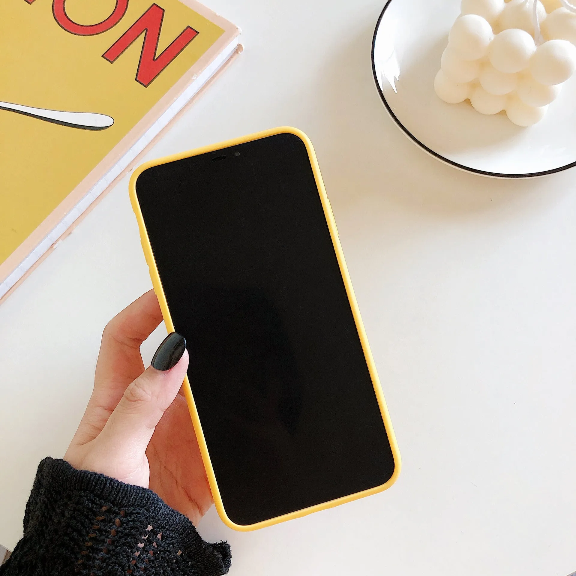 Yellow banana pattern back cover case for iPhone on a white background.