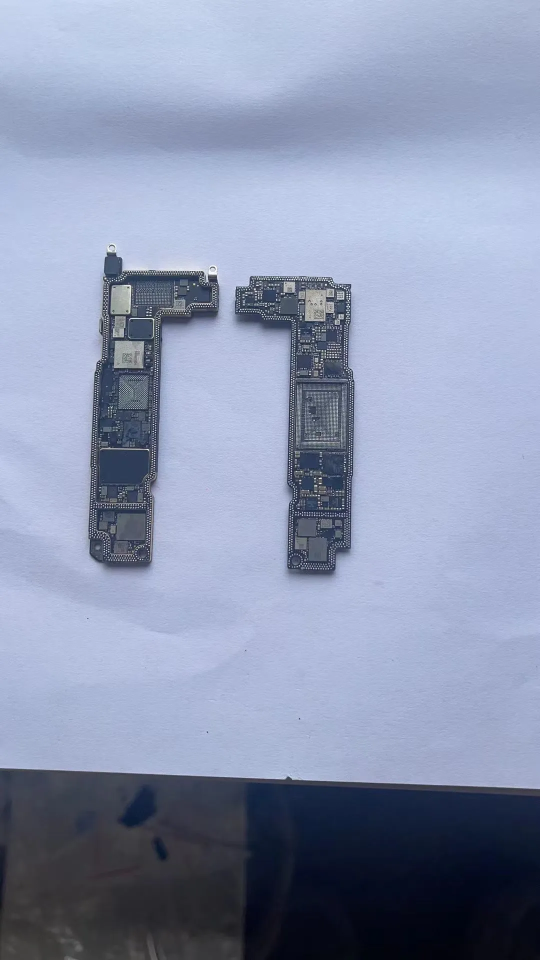 Silver iPhone logic board for 13 Pro Mini and iPhone 12 series models, 256GB US version.