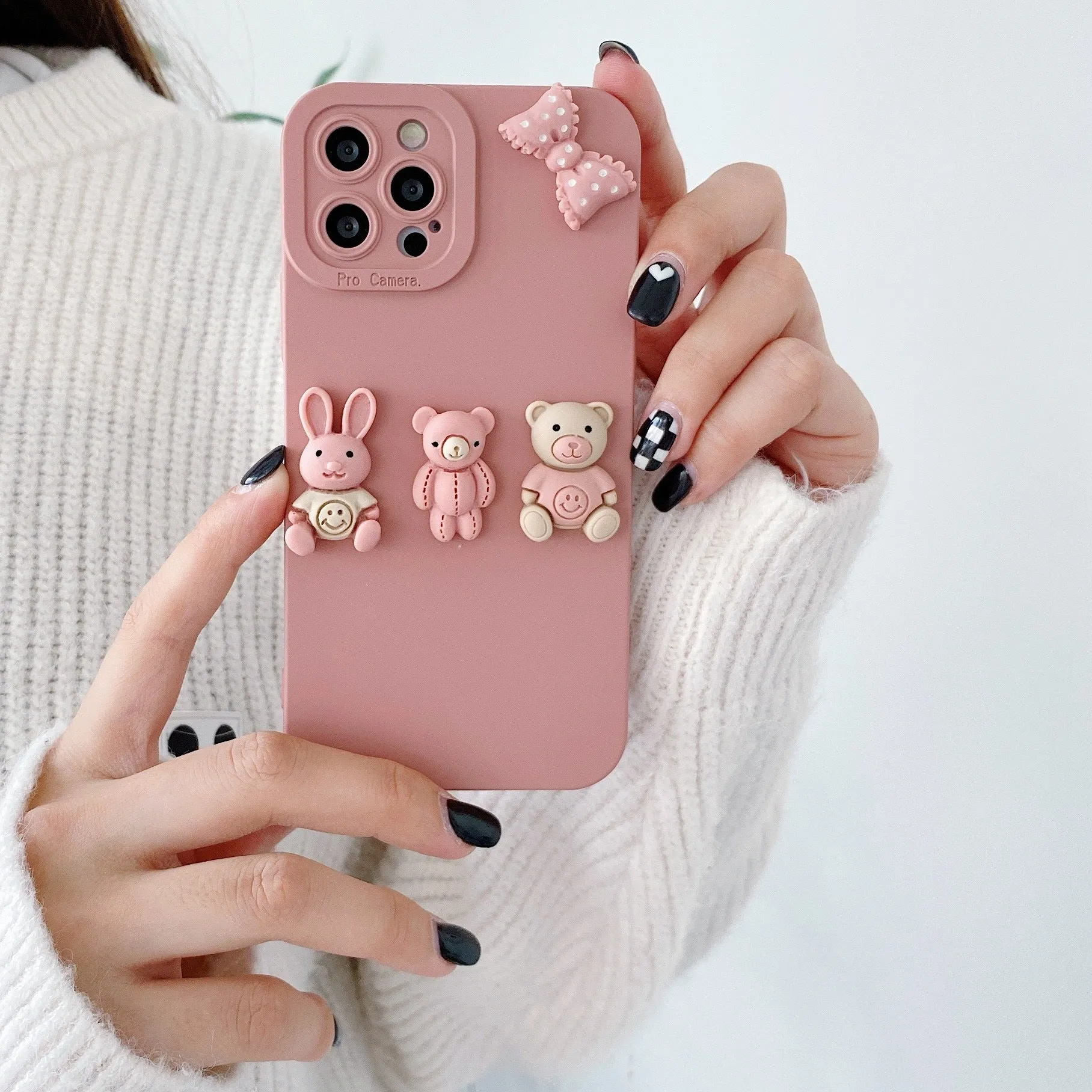 Women's decorative iPhone case with a raised three-dimensional doll bear design on a TPU protective cover.